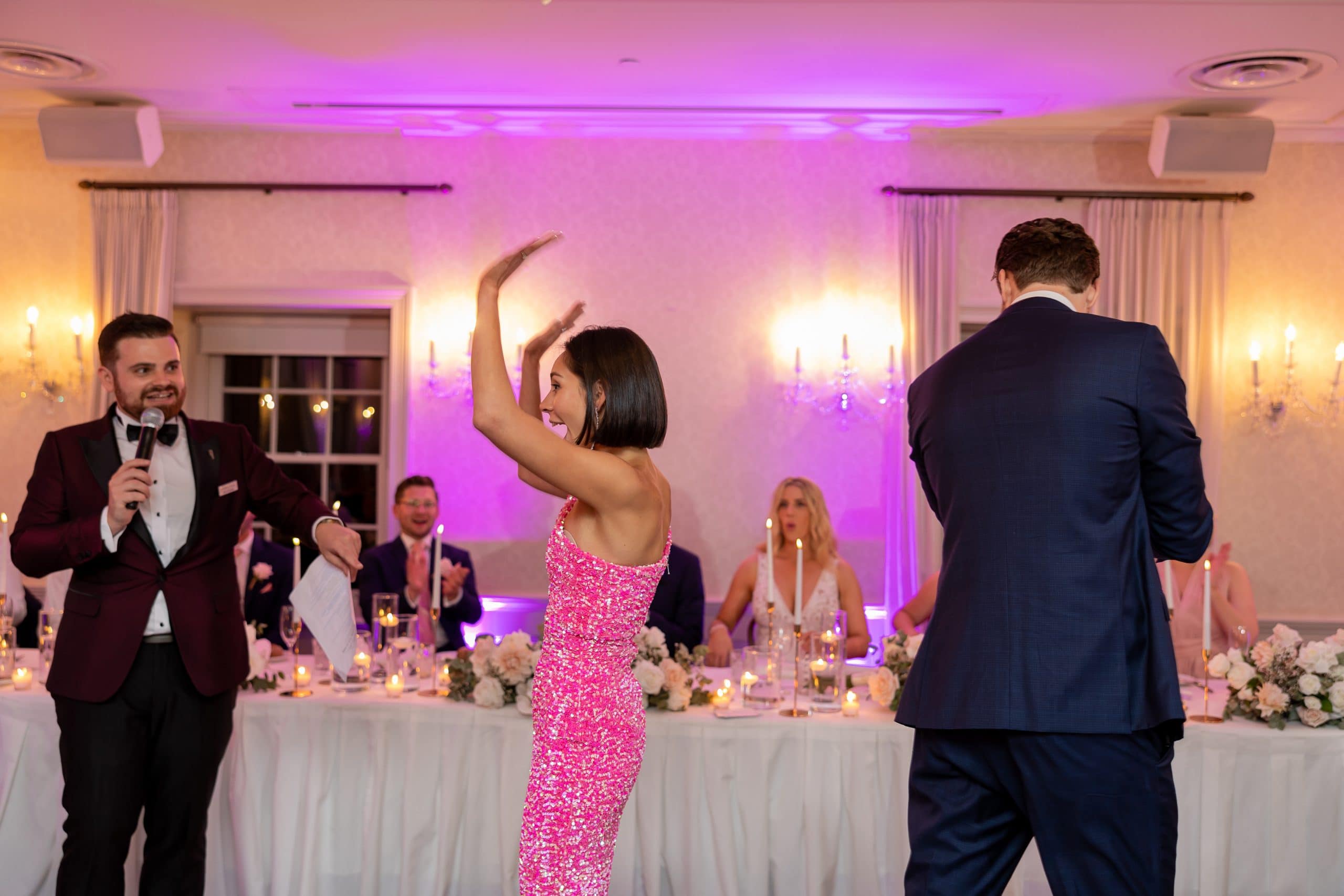 Lady in dancefloor with her hands up playing a game
