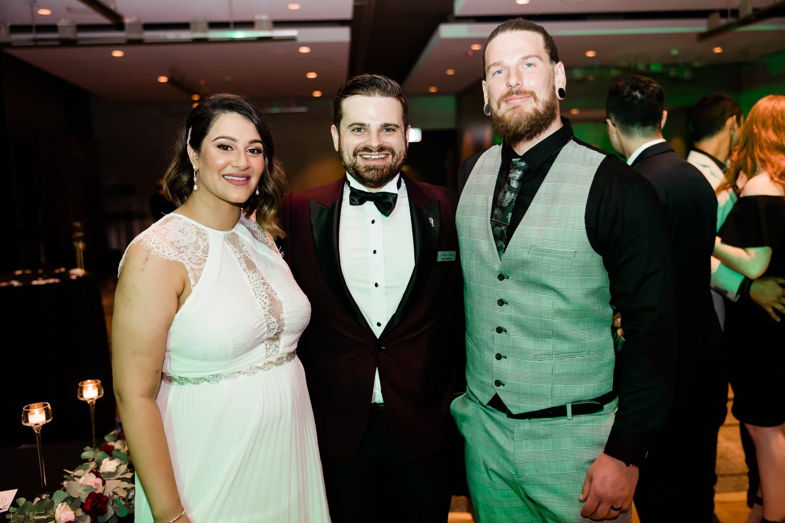 Nathan Cassar posing with bride and groom, Raina and Brodie