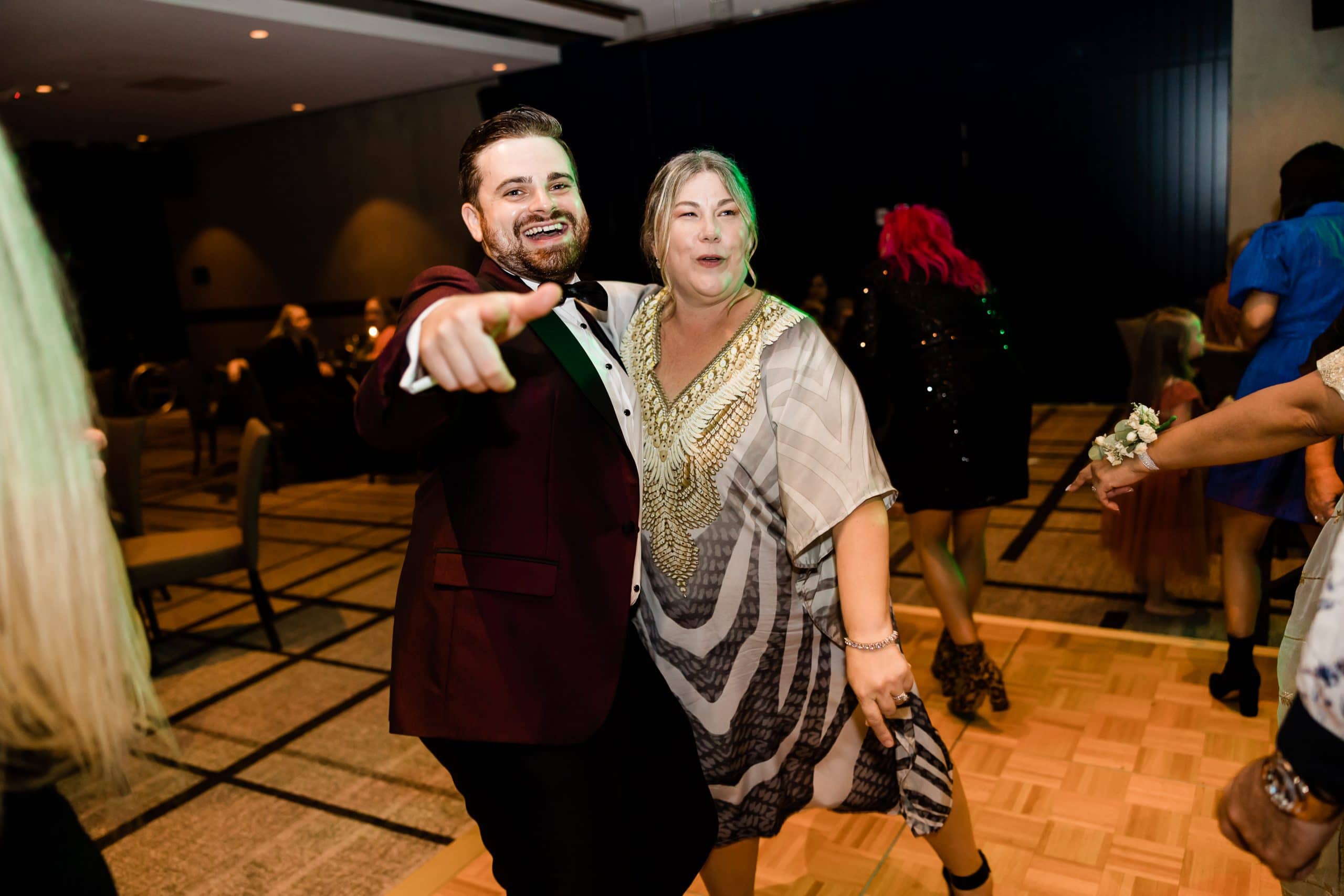 Nathan Cassar dancing with a lady while pointing to the camera