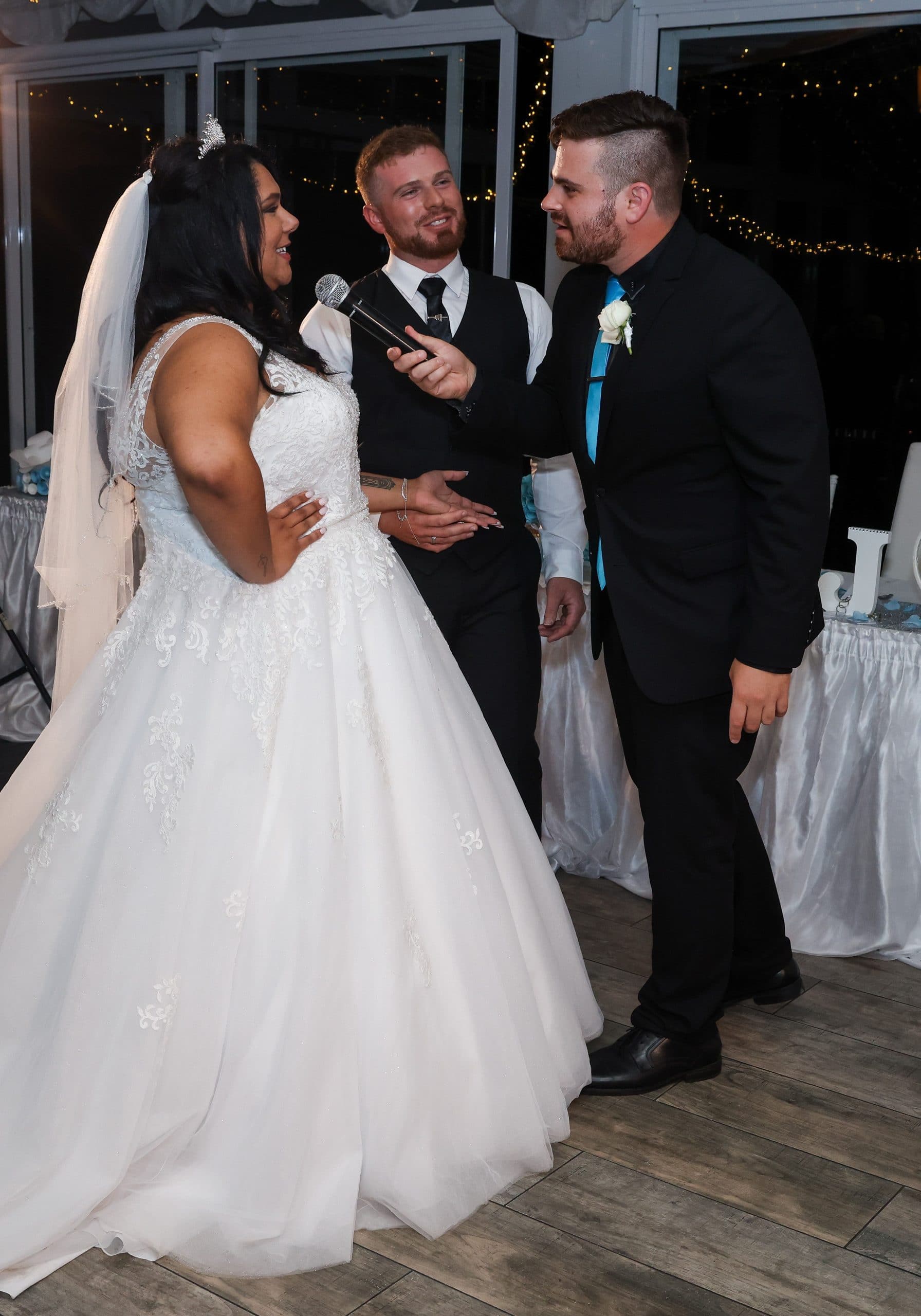 Nathan Cassar asking a bride a question while standing next to the groom