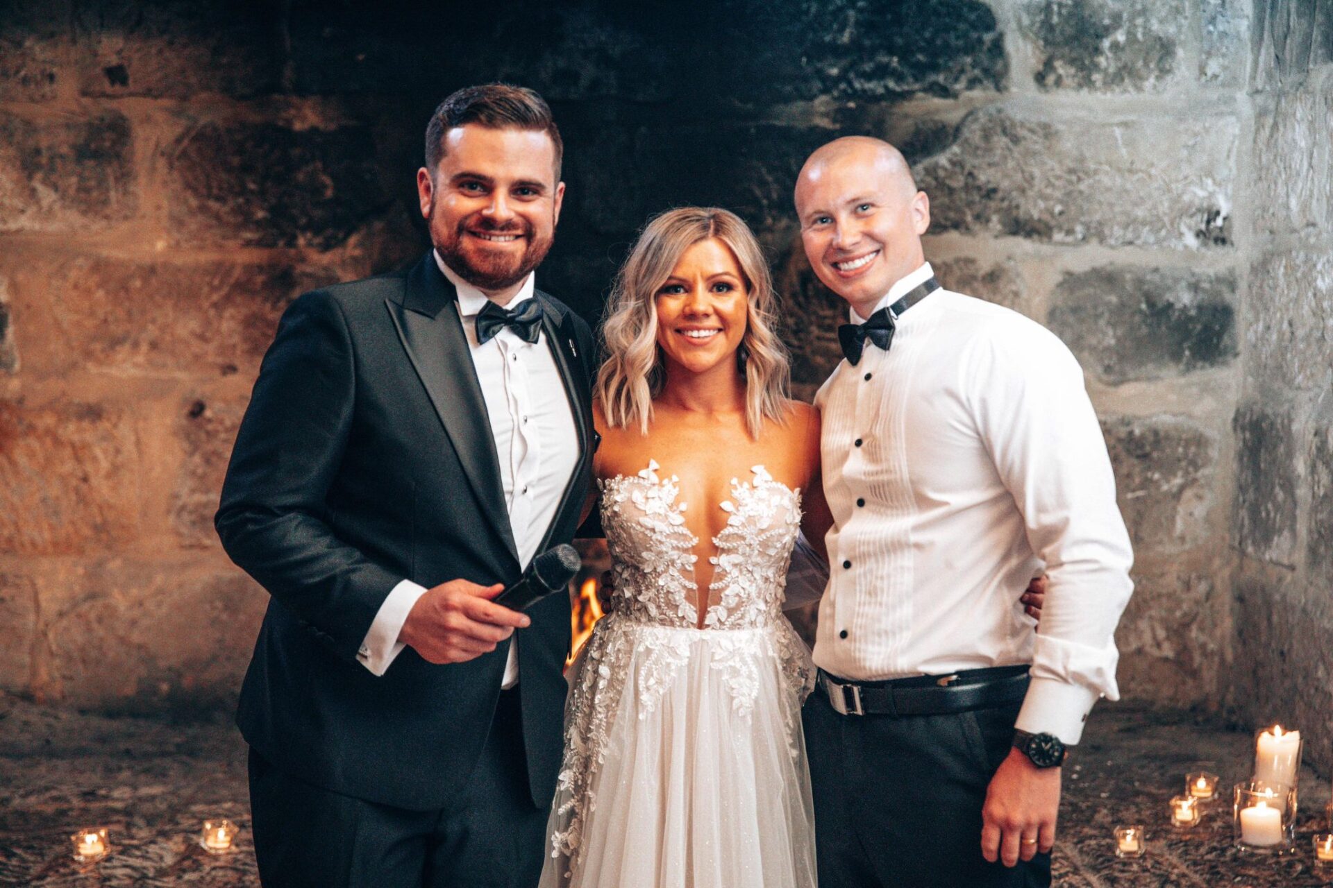 Nahan Cassar MC smiling with newlyweds Kristy and Drew