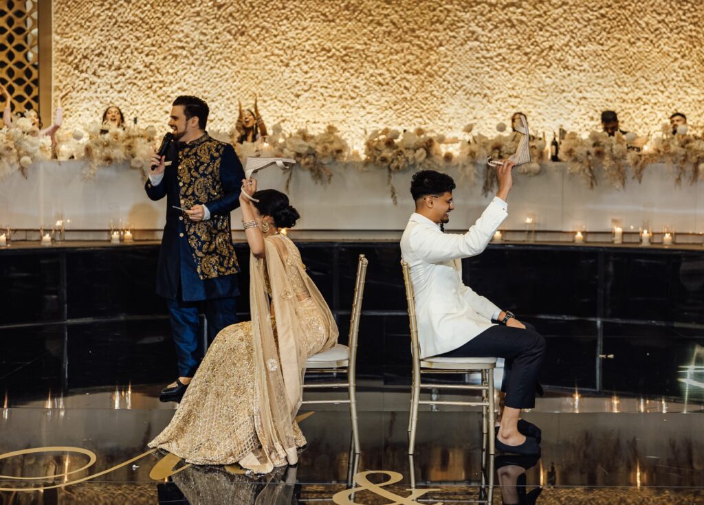 Nathan at an Indian wedding playing the shoe game to entertain the guests