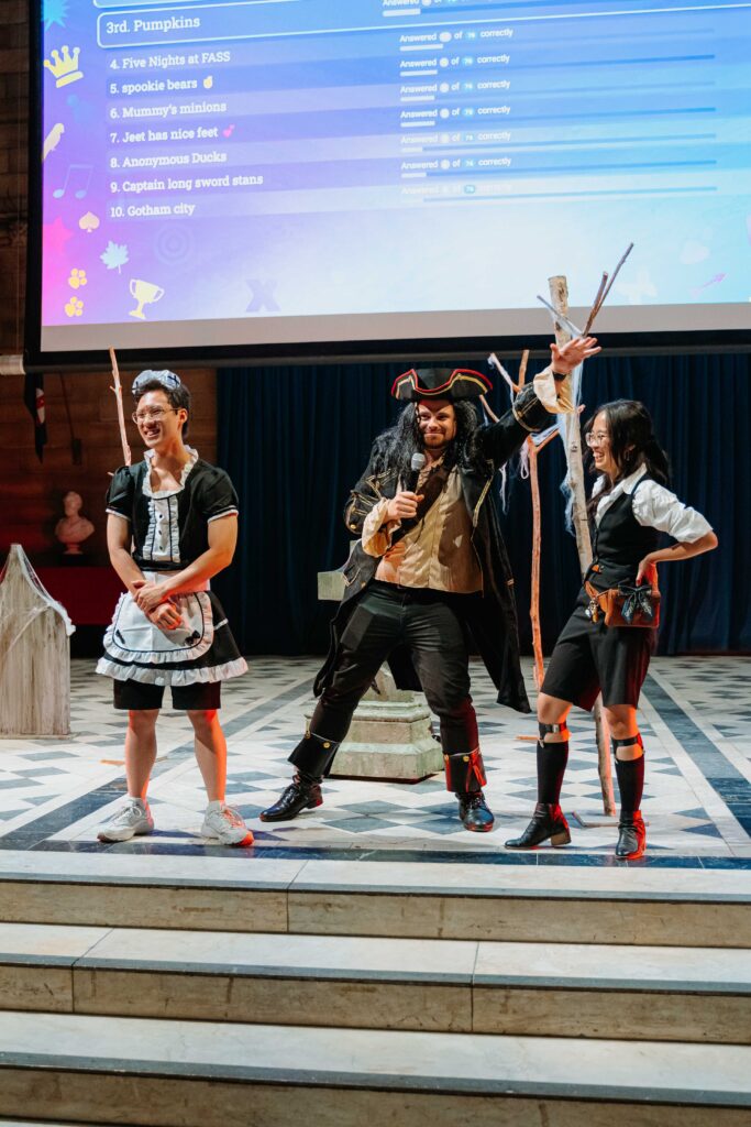 Costumed performers on stage during live presentation