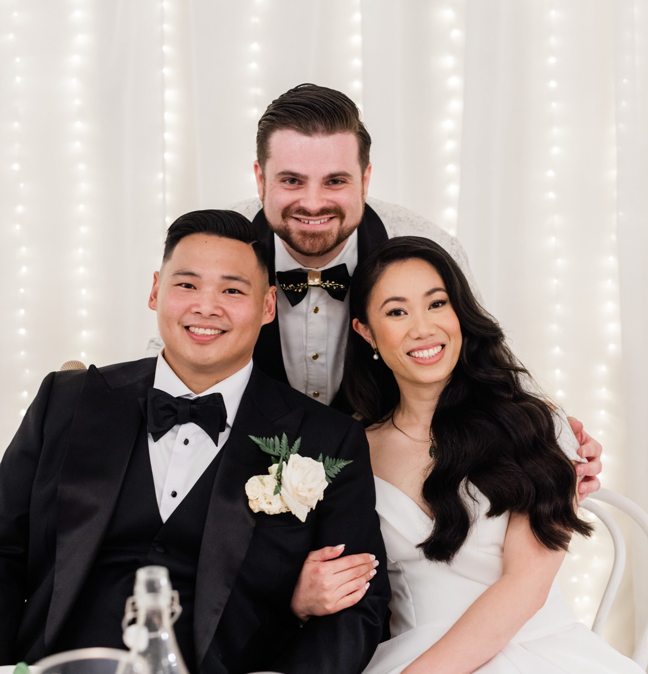 Smiling couple with friend at wedding reception with Nathan Cassar, ceremony master wedding