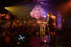MC evening Speaker at podium during gala awards night event