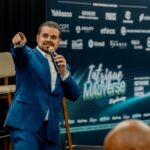 Nathan Cassar, corporate event mc in blue suit presenting at Sydney conference